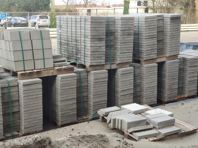 Concrete paving slabs stacked up in a builders yard