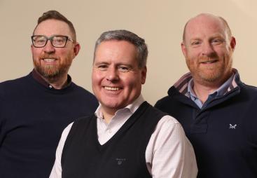 Three smiling men who all work for Oscrete.
