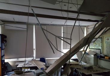 A school classromm with a collapsed roof