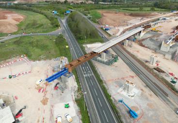 Aerial photo of a blue and brown viaduct under construction
