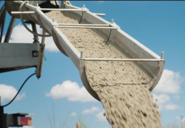 Concrete being unloaded from a concrete mixer