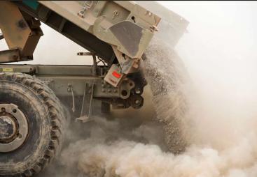 A tipper truck unloading sand