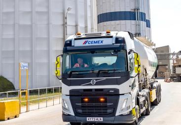 A cement mixer leaving a cement plant