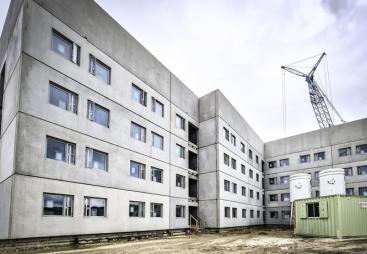The concrete facade of a building under construction