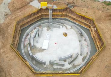 An aerial photo of concrete panels in an octagonal hole