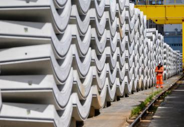 Precast concrete tunnel segments await transport to the construction site
