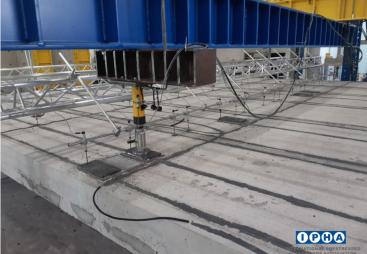 Hollowcore concrete beams under pressure in a laboratory