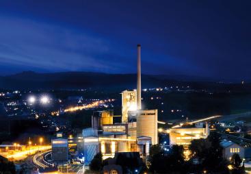 A night time photo of the Jura Cement Plant, Wildegg, Switzerland, which produces approximately 1 million tonnes of cement for the Swiss market and is a leader in the use of alternative fuels.