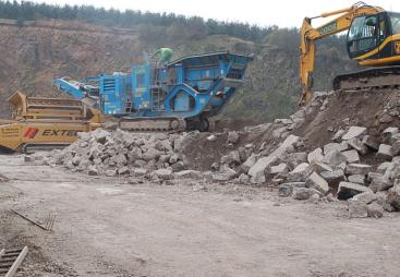 Two crushers and an excavator help recycle concrete in a quarry