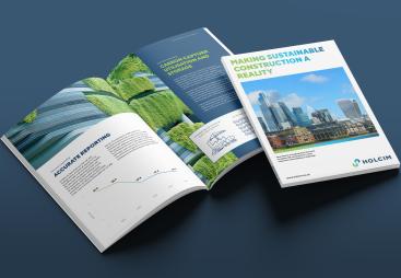 A picture of Holcim UK’s new report - Making Sustainable Construction a Reality - open on a desk. The report outlines its commitments to sustainable construction, following research that reveals growing public concern over the environmental performance of the built environment.