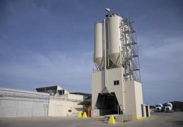 The Wallan site includes four cementitious silos, 10 ground bins for raw materials, a modern office with driver amenities, and undercover truck parking. 