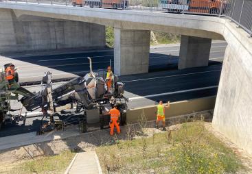 Wirtgen's SP 33 slipform paver, unveiled at World of Concrete 2025 (21-23 Jan), Las Vegas, US, before getting its European debut at this year's bauma (7-13 Apr) in Munich, Germany, working under a concrete bridge on a motorway.