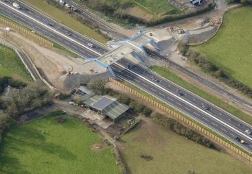 An aerial view of the Marazanvose green bridge spanning the new dual carriageway and old A30.