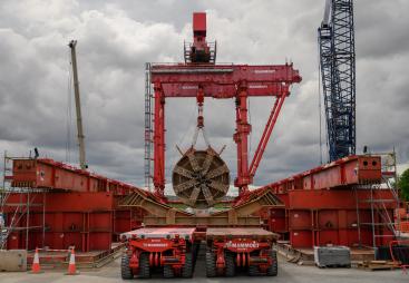 The large, red TBM Emily’s cutterhead lifted at Green Park Way shaft following completion of Northolt Tunnel section
