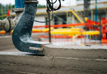 The Instatiq P1 printer head applying solid concrete walls directly on site, cutting build time and emissions.