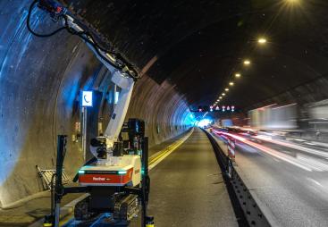 A Baubot robot drilling anchor holes to prepare for reinforced concrete linings in the Engelberg Tunnel, Germany.
