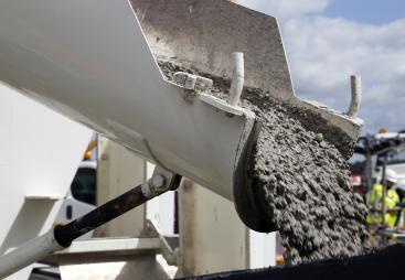 Concrete sliding off a delivery chute on a truck