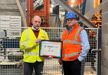 Chris Jones (right) of Mona Precast with David Wyke (left) of KVM, marking 25 years of block production at the Anglesey site.