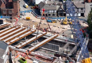 A blue crawler crane lifts Beam 9 into position at Greek Street last month (August, 2025).