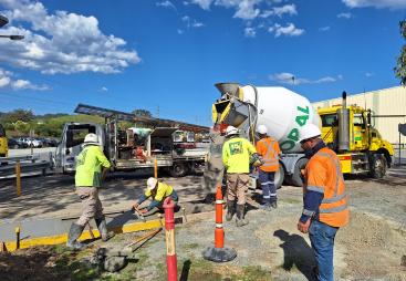Men in PPE on a construction site where Boral has trialled the use of recarbonated recycled aggregates in its low-carbon Envisia concrete