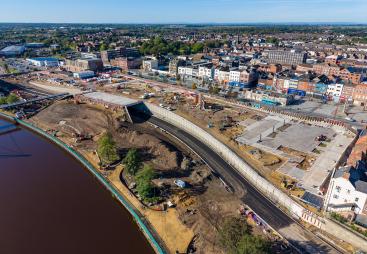 An aerial photo of the the Stockton Waterfront Urban Park. with the town in the background