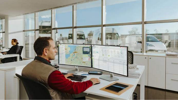 A man sitting in front of a computer