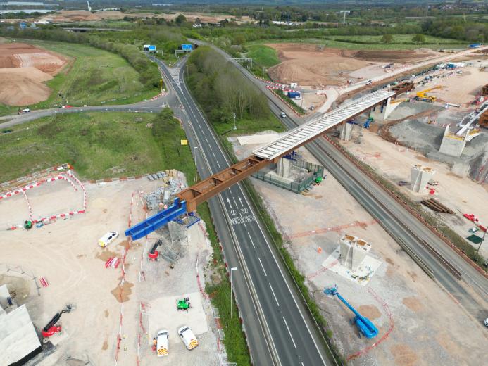 Aerial photo of a blue and brown viaduct under construction