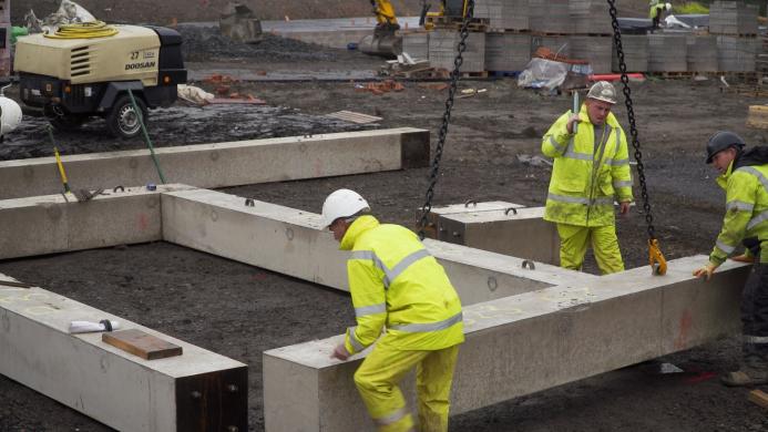 Construction workers in hi viz PPE working outside