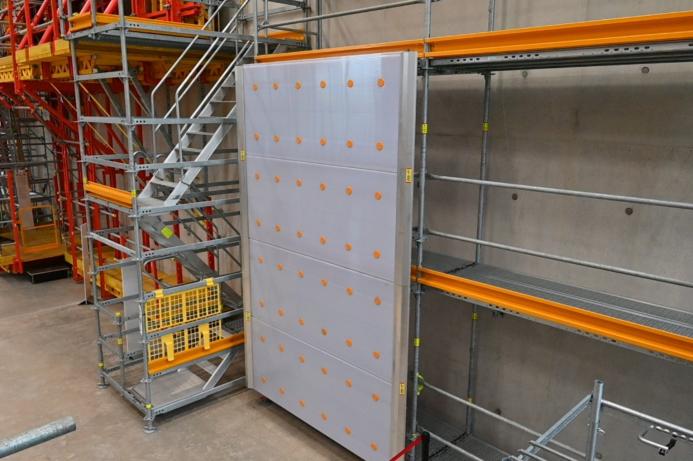 A grey scaffolding cladding panel