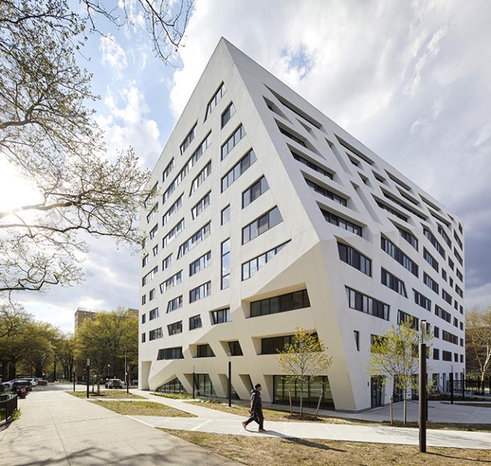 A white, 11 storey angular building