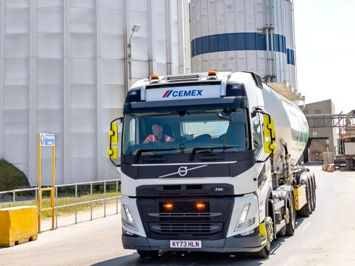 A cement mixer leaving a cement plant