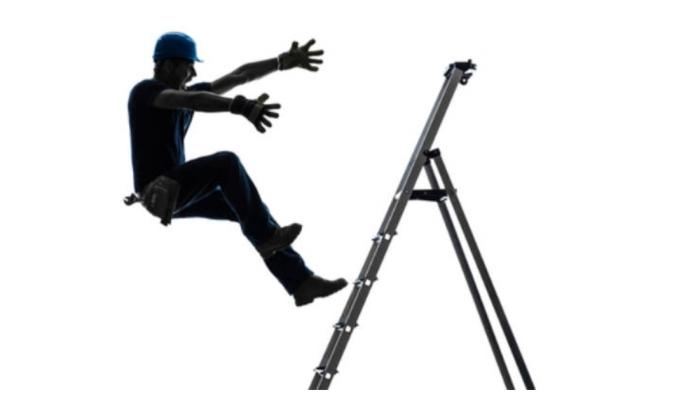 A studio created photo of a man in silhouette falling of a ladder