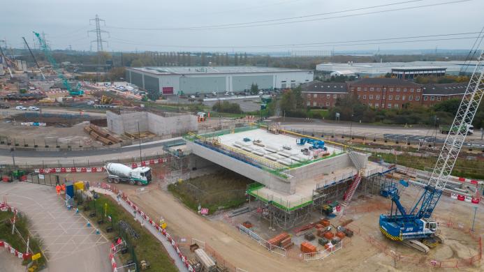 An aerial photo of an HS2 construction site showing a large concrete structure and a blue crane