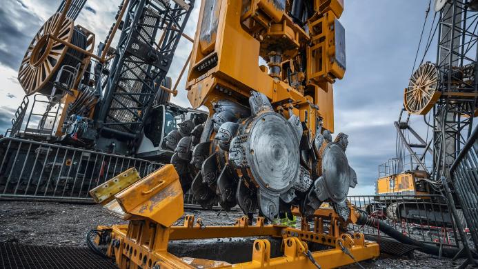 A close up view of a BAUER MC 96 duty-cycle crane with BC 48 trench cutter.