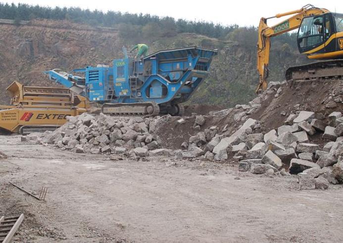 Two crushers and an excavator help recycle concrete in a quarry