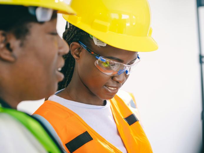 Two women in PPE.
