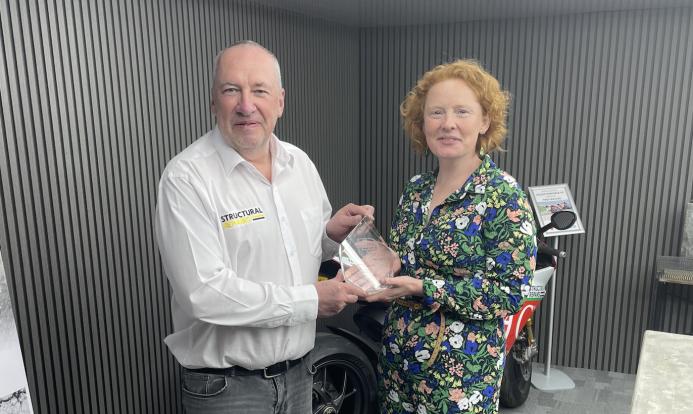 Roger Line of Structural Repairs receives the New Product Award from Concrete Connect editor, Clare Howcutt-Kelly.