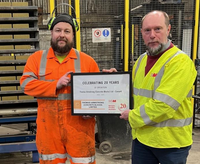 David Wykes, General Manager of KVM UK (left), presents a certificate to Christopher Appleton 