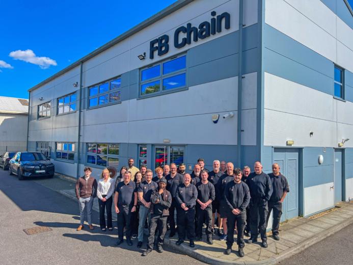 FB Chain employees celebrate 40 years of conveyor chain manufacture and innovation outside the company's factory.