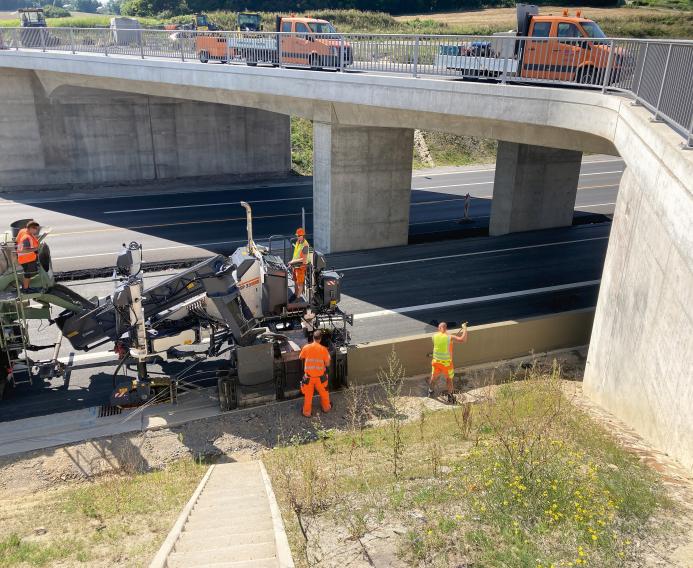 Wirtgen's SP 33 slipform paver, unveiled at World of Concrete 2025 (21-23 Jan), Las Vegas, US, before getting its European debut at this year's bauma (7-13 Apr) in Munich, Germany, working under a concrete bridge on a motorway.
