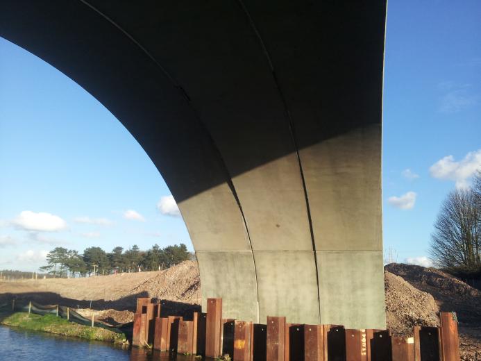The masonry-clad arch bridge over the historic Chesterfield Canal, one of two critical structures forming the new access road to the Worksop Sludge Treatment Facility (STF) in Nottinghamshire. Image: ABM Precast Solutions.