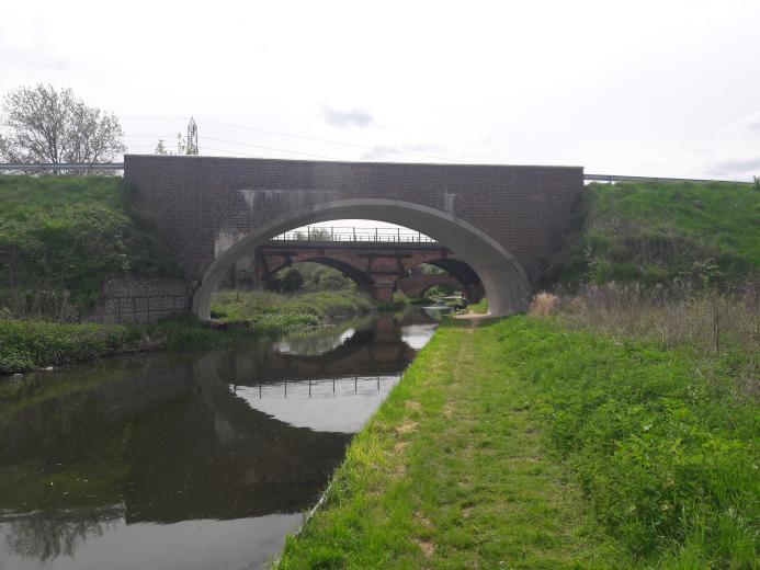 Three bridges - a new masonry clad bridge, with the original 18th century bridge and the new bridge seen through its span - on the River Ryton, in Nottinghamshire. Image: ABM Precast Solutions. 