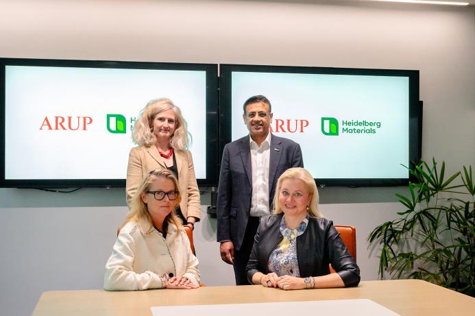 Signing the Memorandum of Understanding. Seated (left to right): Dame Jo da Silva (chief sustainable development officer, Arup), Dr Katharina Beumelburg (chief sustainability and new technologies officer, Heidelberg Materials); standing behind (left to right): Jemima Bruin-Bland, carbon capture and utilisation lead – UKIMEA, Arup), Mubarik Chowdhry (vice president global key account and product management evoZero, Heidelberg Materials)