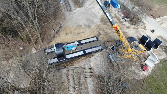 Precast concrete bridge elements being lifted into place