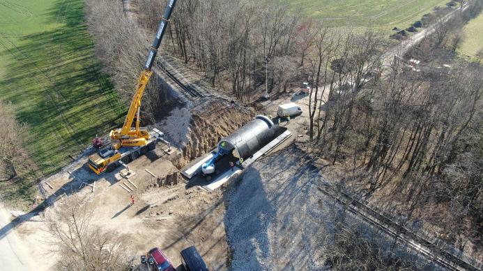 Precast concrete bridge elements being lifted into place