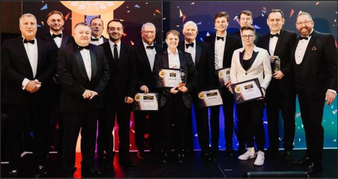 A large group of smiling people in dinner dress, Winners of the FPS Awards 2024