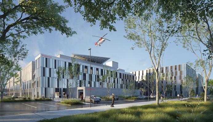A red helicopter flies over the new Caen University Hospital, which features 110,000 m² of healthcare space built using lower-carbon concrete. Photo Credit: ©CHU de Caen Normandie