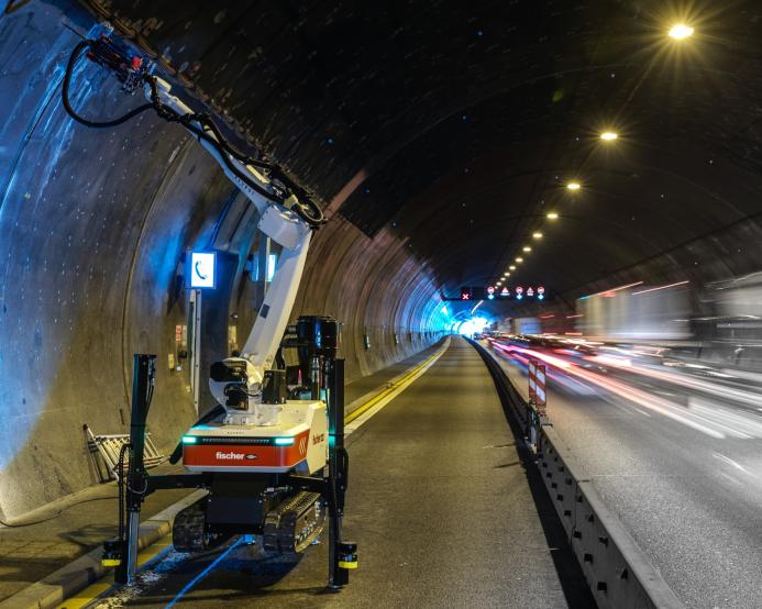A Baubot robot drilling anchor holes to prepare for reinforced concrete linings in the Engelberg Tunnel, Germany.