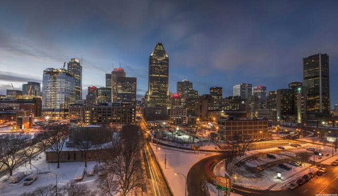 The Montréal towards sunset with a ligh dusting of snow covering the ground