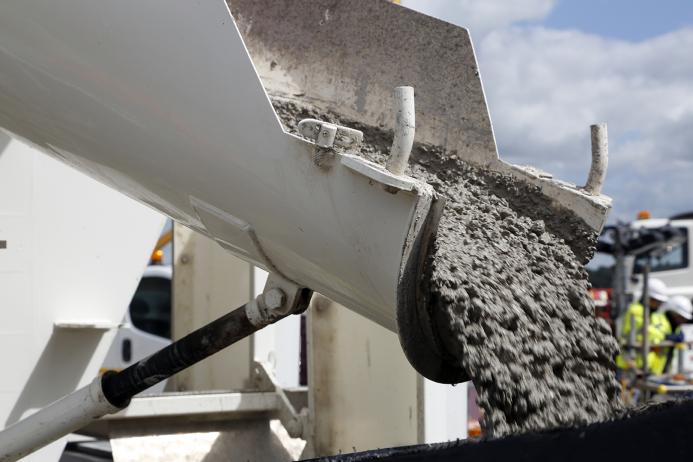 Concrete sliding off a delivery chute on a truck